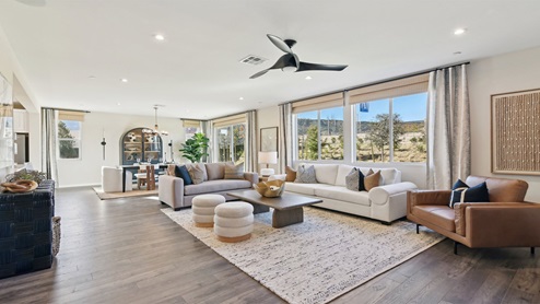 Spacious open-concept great room and dining room with slider leading to rear yard