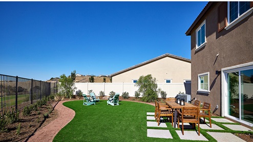Spacious backyard with patio area and outdoor furniture