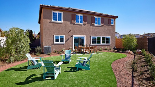 Spacious backyard with patio area and outdoor furniture