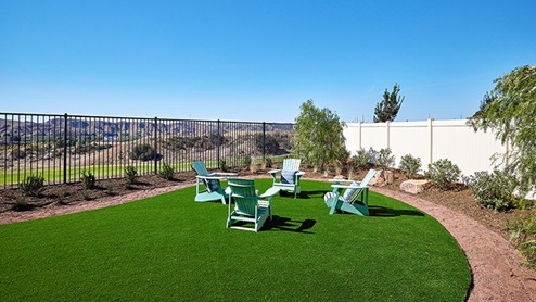 Spacious backyard with patio area and outdoor furniture