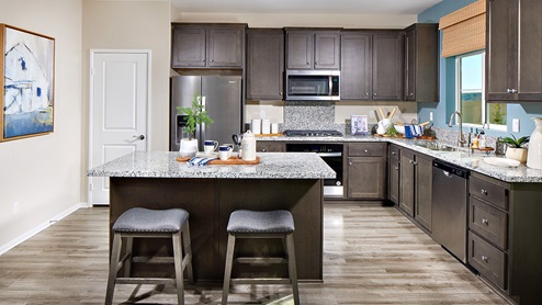 modern open-concept kitchen area with granite countertops