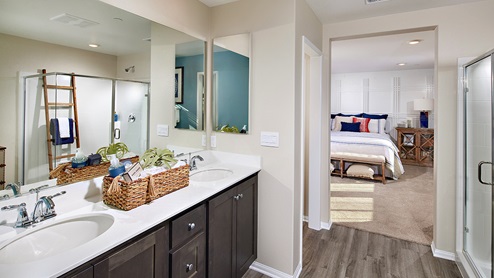 Primary bathroom with walk in shower and double sinks
