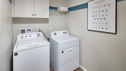 Laundry room with upper cabinet