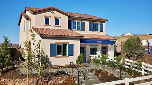 Two-story home with navy blue shutters