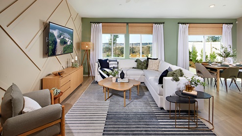 modern open-concept living area with back patio door