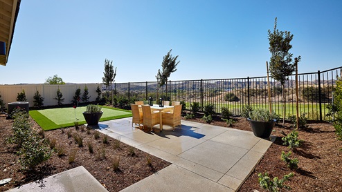 Spacious backyard with patio area and outdoor furniture