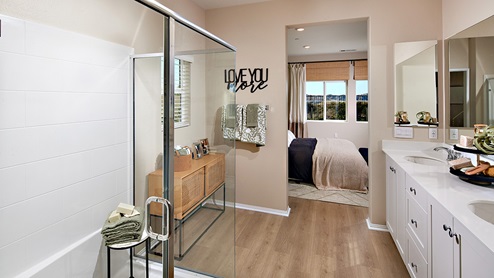 Primary bathroom with walk in shower and double sinks