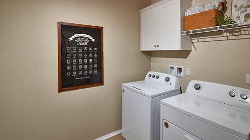 Laundry room with upper cabinet