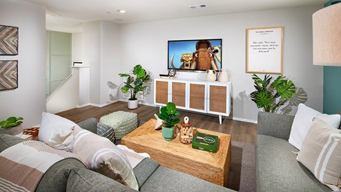 Open-concept loft area with plush carpet