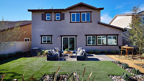 Spacious backyard with patio area and outdoor furniture