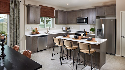Kitchen peninsula with stainless steel appliances, and pantry