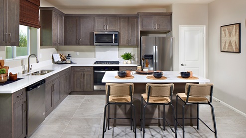 Kitchen peninsula with stainless steel appliances, and pantry