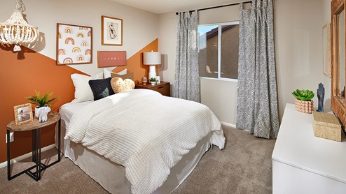 Fully furnished bedroom with plush carpet