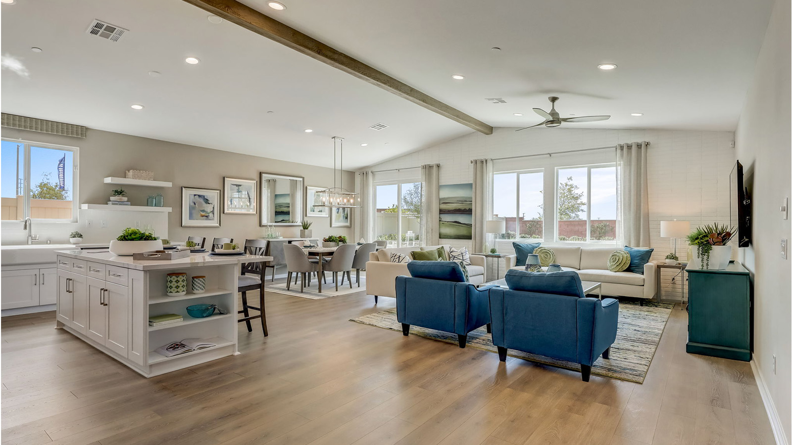 Spacious open-concept great room, dining room and kitchen with vaulted ceiling