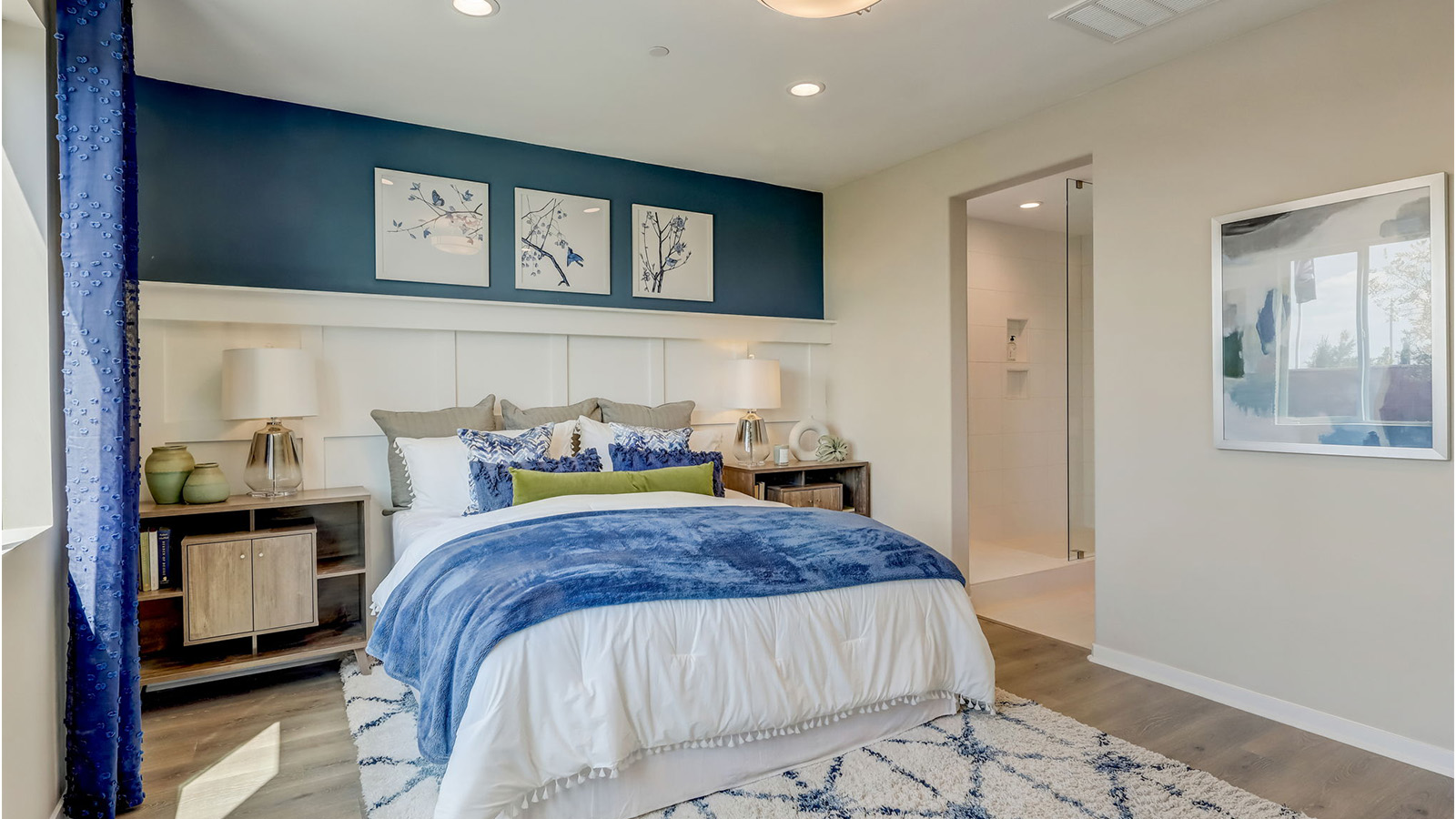 Fully furnished primary bedroom with king bed