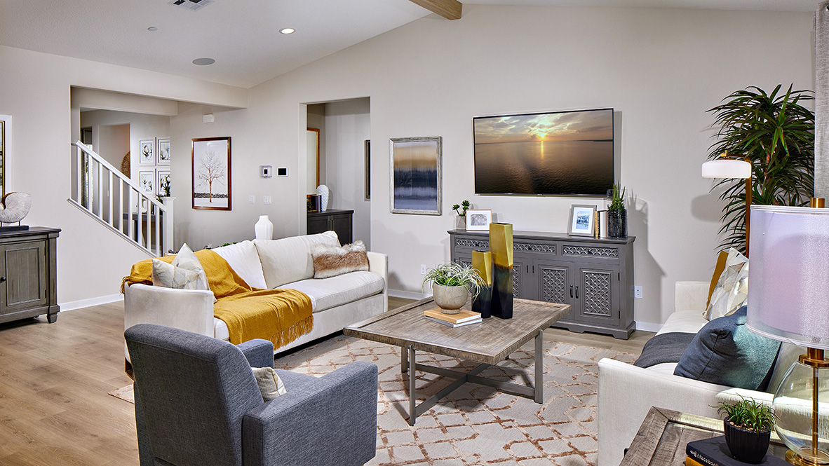 Spacious open-concept great room with vaulted ceiling