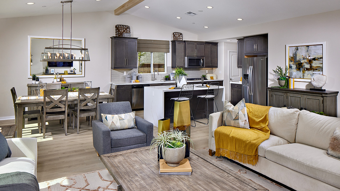 Spacious open-concept great room, dining room and kitchen with vaulted ceiling