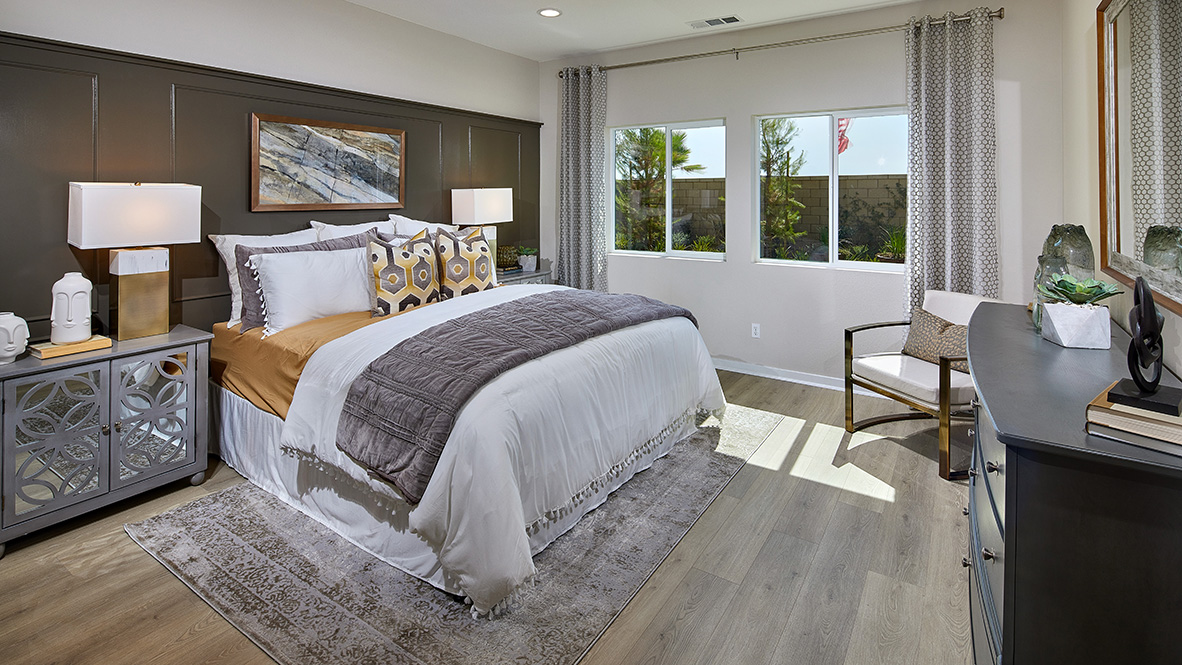 Spacious primary bedroom with king bed