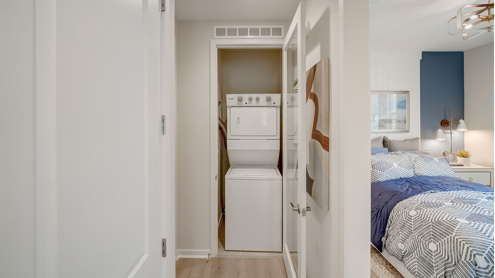 Multi-gen hallway with laundry closet with stackable washer and dryer