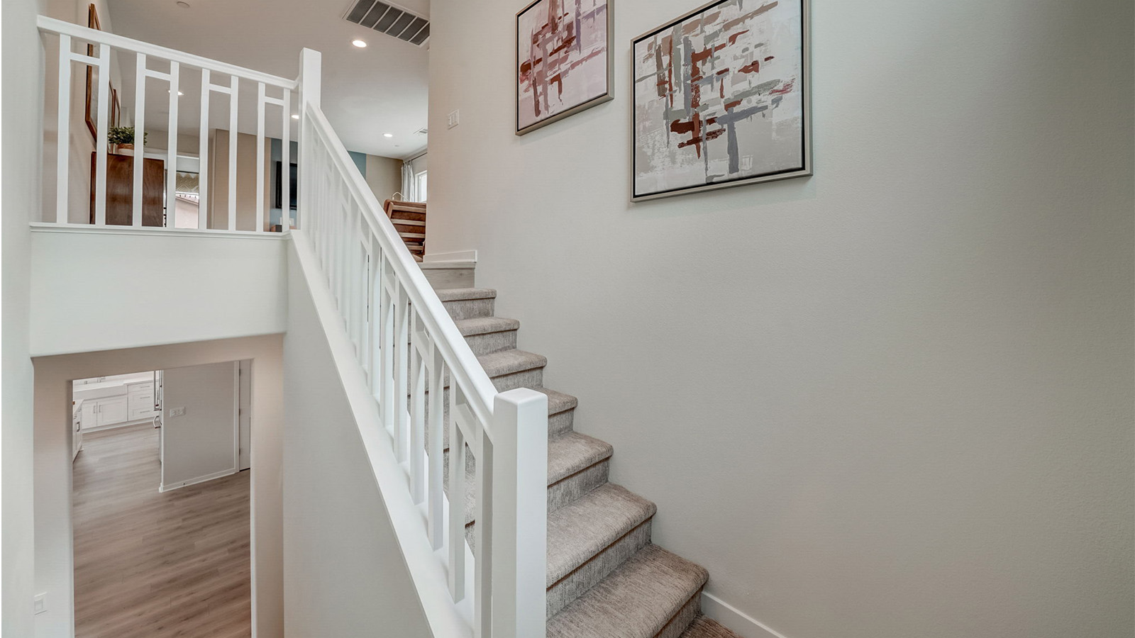 Open staircase with white handrail