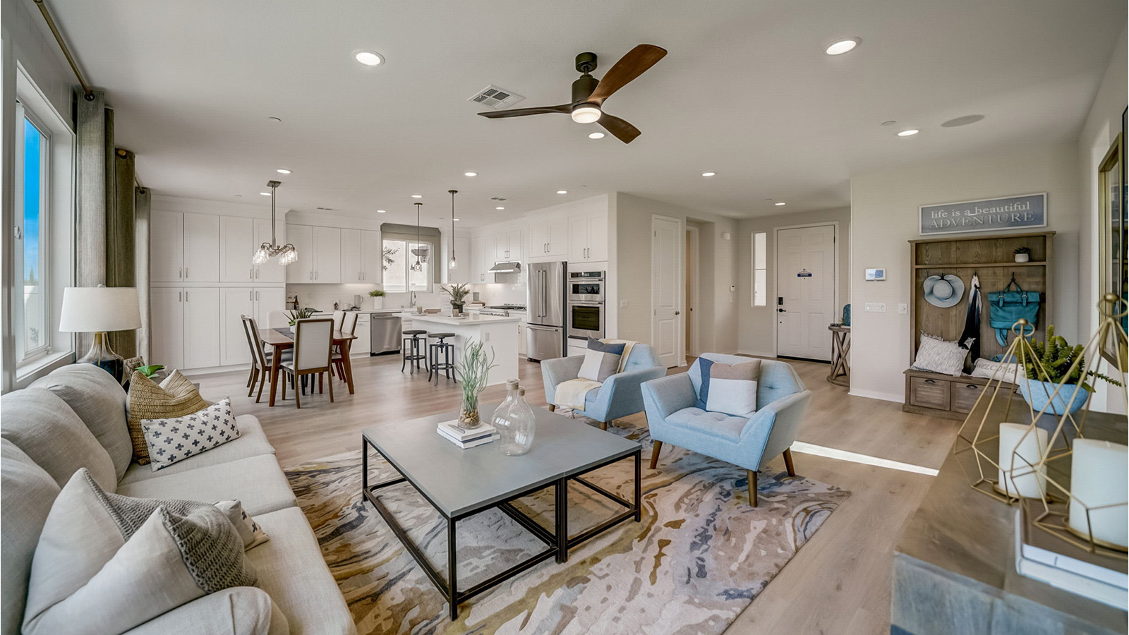 Spacious open-concept great room, dining room and kitchen with slider to rear yard