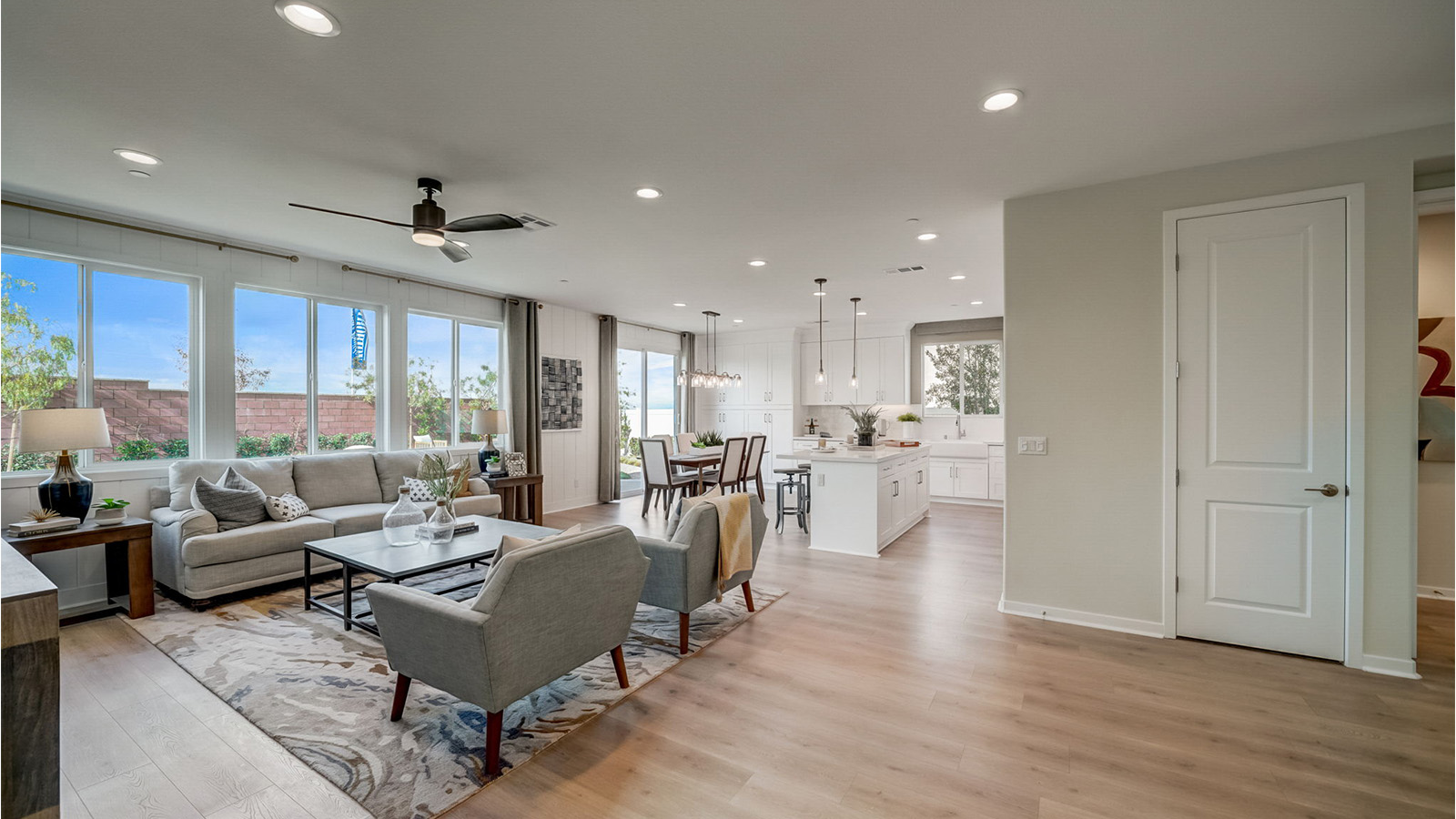 Spacious open-concept great room, dining room and kitchen with slider to rear yard