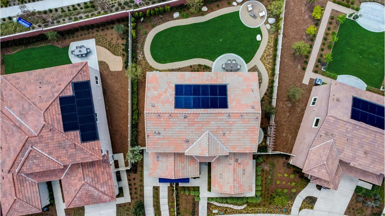 Aerial view of model homes with solar panels