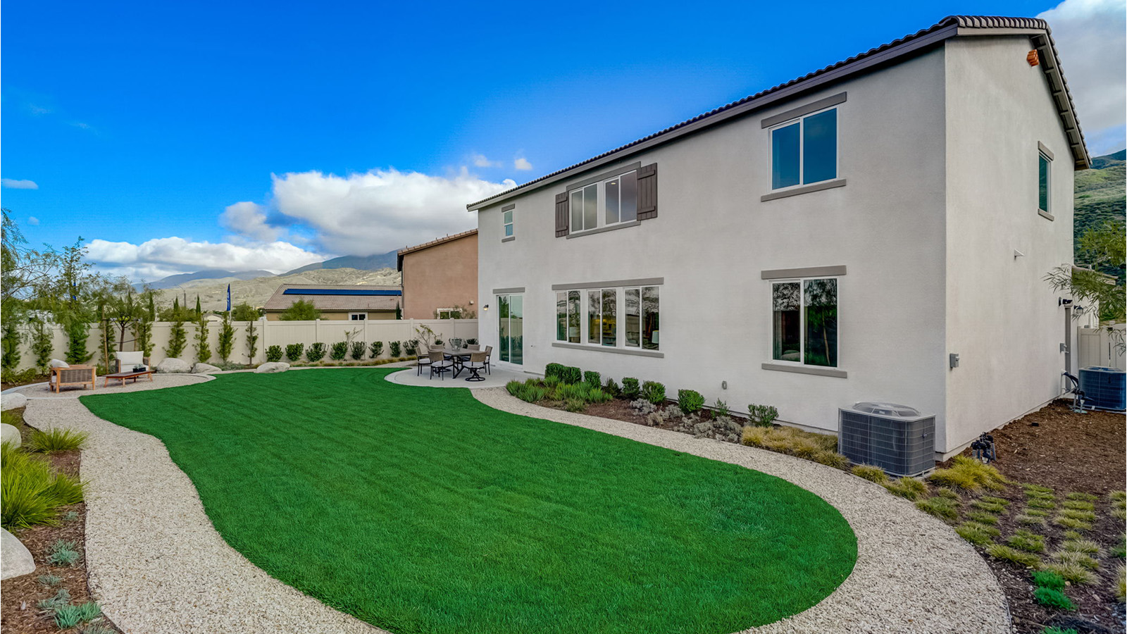 Spacious backyard with patio area