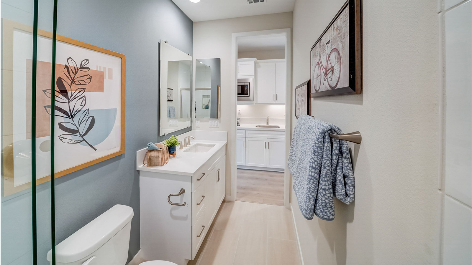 Multi-gen bathroom with vanity and shower