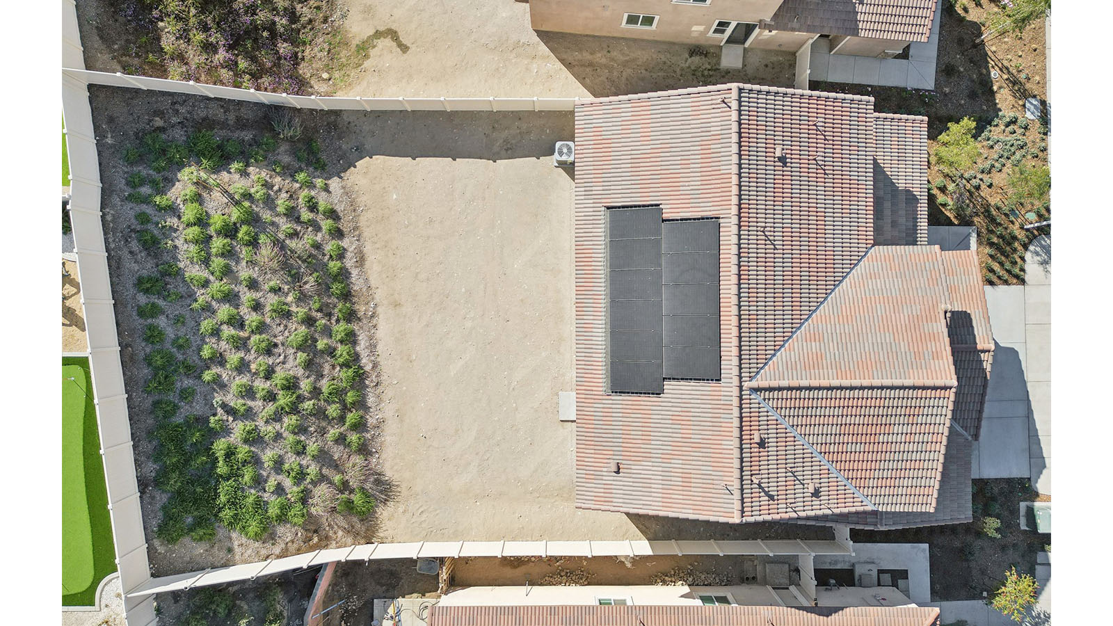 Aerial view of home with solar panels