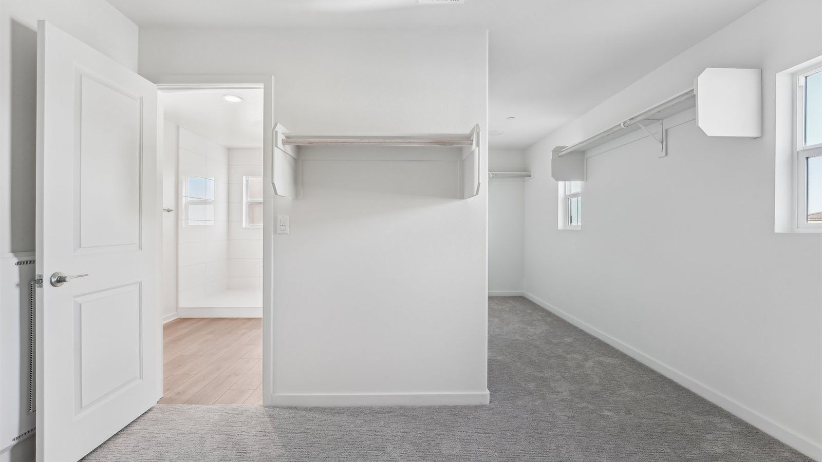 Spacious primary walk-in closet