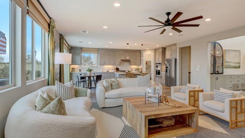 Open-concept great room with slider to rear yard