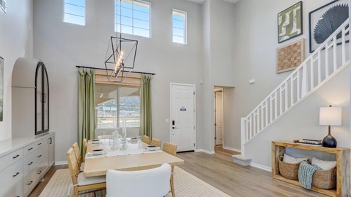 Spacious open-concept dining room with vaulted ceilings