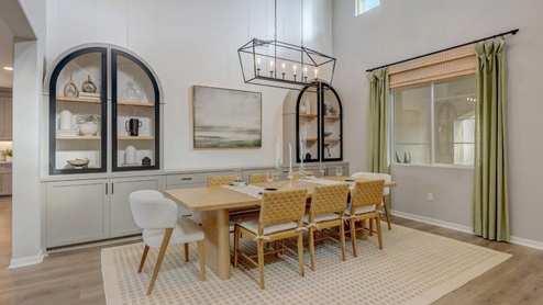 Spacious open-concept dining room with vaulted ceilings