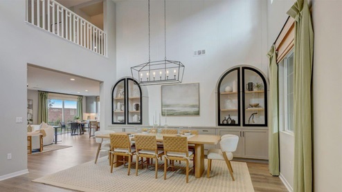 Spacious open-concept dining room with vaulted ceilings