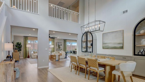 Spacious open-concept dining room with vaulted ceilings