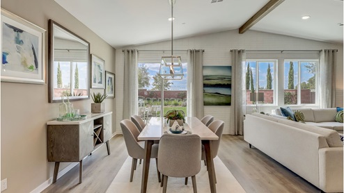 Open-concept dining area with slider to rear yard