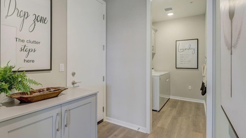 Hallway with cabinetry space