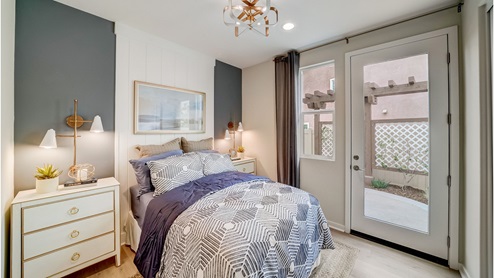 Multi-gen bedroom with French door to side yard