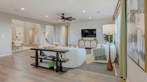 Open-concept great room with slider to rear yard