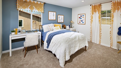 Vista Verde in Highland model home teens bedroom with white bedding with white desk