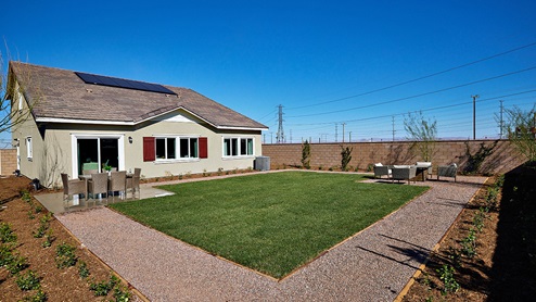 Spacious backyard with large lawn area