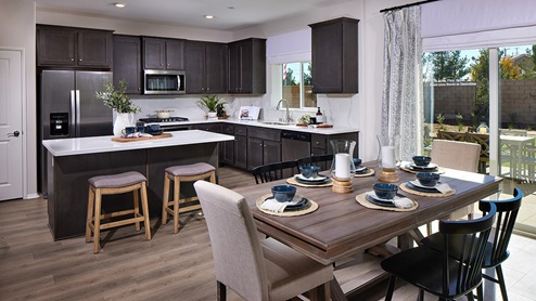 Open-concept kitchen area with stainless steel appliances