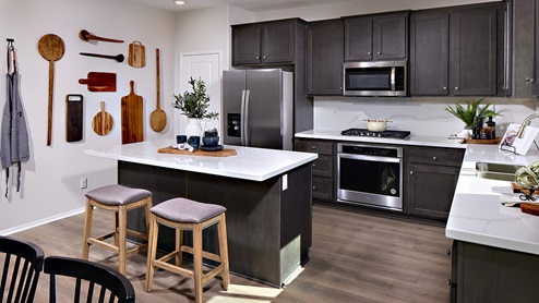 Open-concept kitchen area with stainless steel appliances