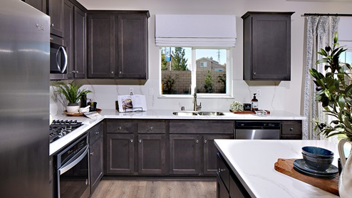 Open-concept kitchen area with stainless steel appliances