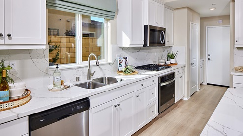 Kitchen peninsula with stainless steel appliances