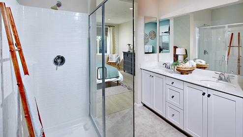 Primary bathroom with walk in shower and double sinks
