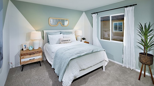 Fully furnished bedroom with plush carpet