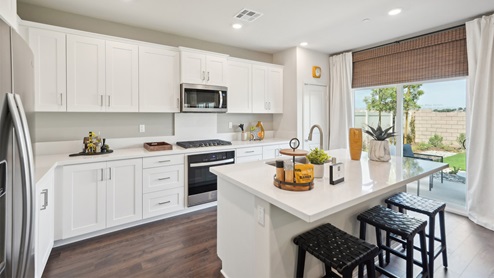 Kitchen peninsula with stainless steel appliances