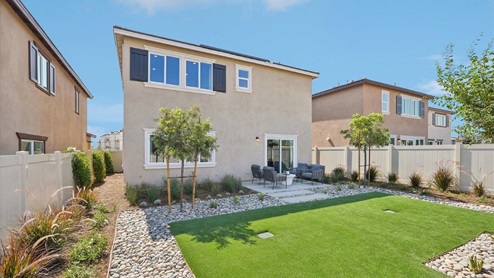 Spacious backyard with patio area